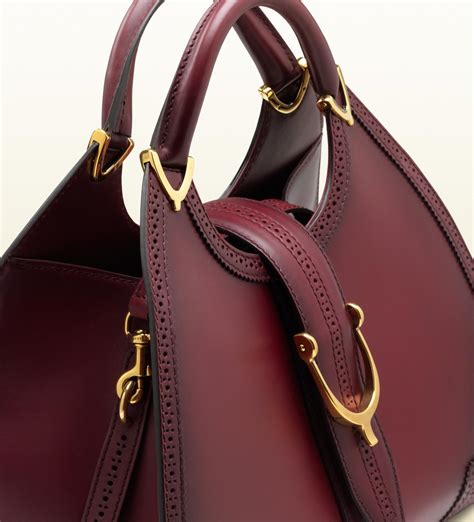 gucci purple stirrup bordeaux leather top handle bag|gucci handbags for sale.